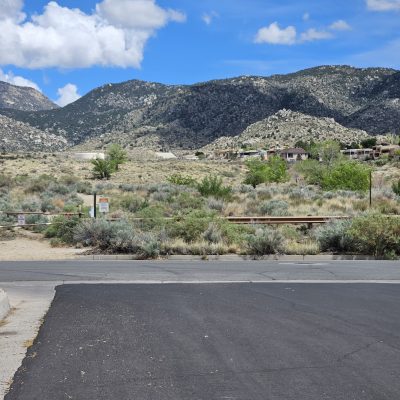 Mountain view with desert landscape and houses.