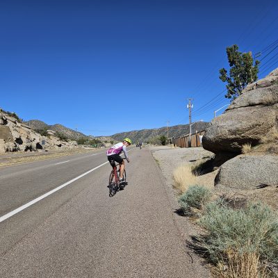 Cyclist riding on scenic mountain road